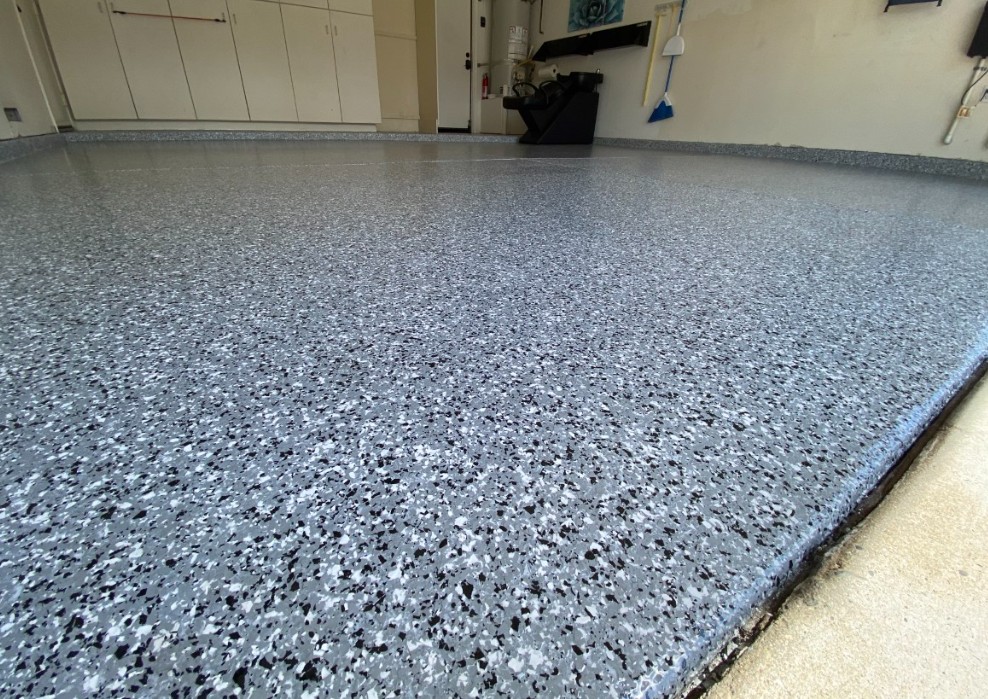 Flake epoxy garage floor installed in Conway SC — blue gray chip system by Bakerss Property Maintenance