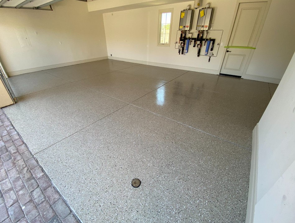 Flake epoxy high gloss garage floor installed in Conway SC — light gray chip system by Bakerss Property Maintenance