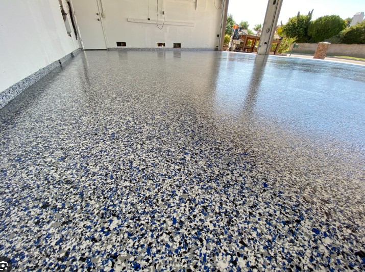 Flake epoxy garage floor in Horry County SC — blue gray white black chip system by Bakerss Property Maintenance