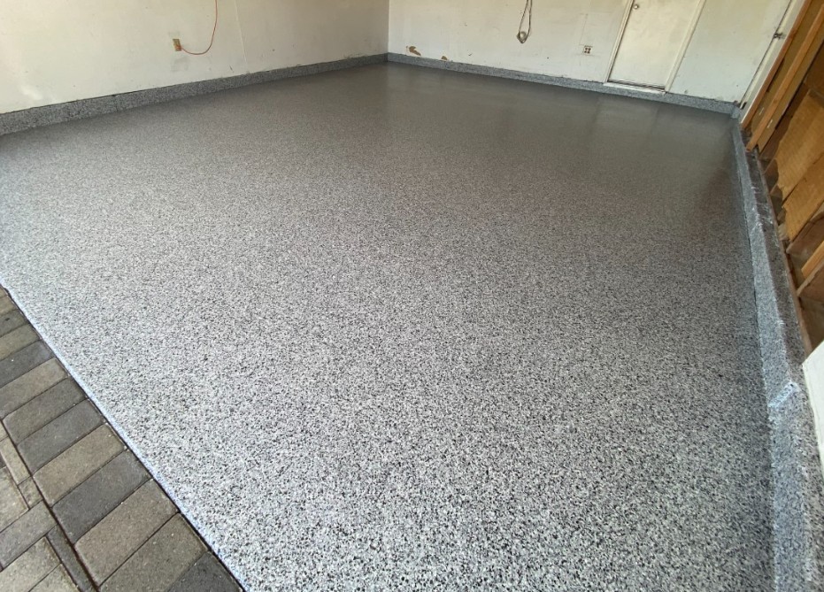 Flake epoxy garage floor installed in Murrells Inlet SC — medium gray chip system by Bakerss Property Maintenance