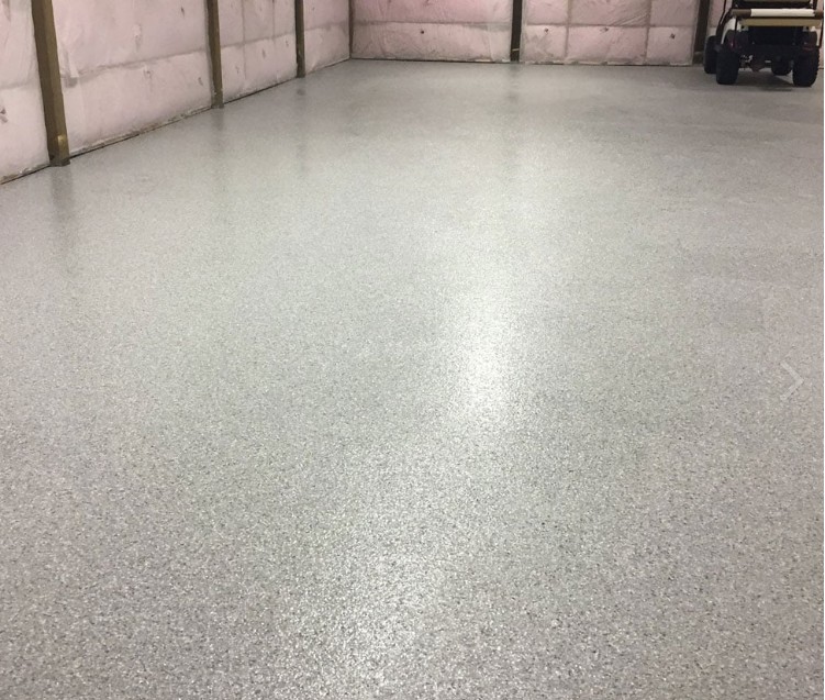 Flake epoxy floor installed in Myrtle Beach garage — light gray chip system by Bakerss Property Maintenance