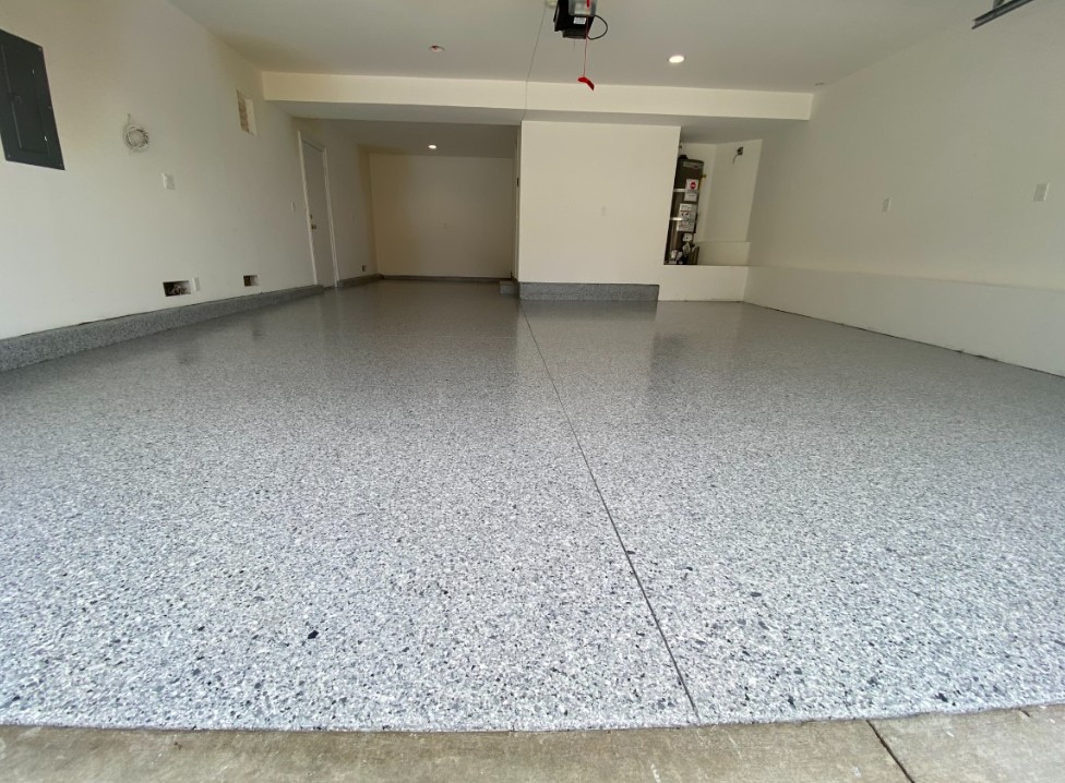 Flake epoxy garage floor installed in Surfside Beach SC — gray chip system by Bakerss Property Maintenance
