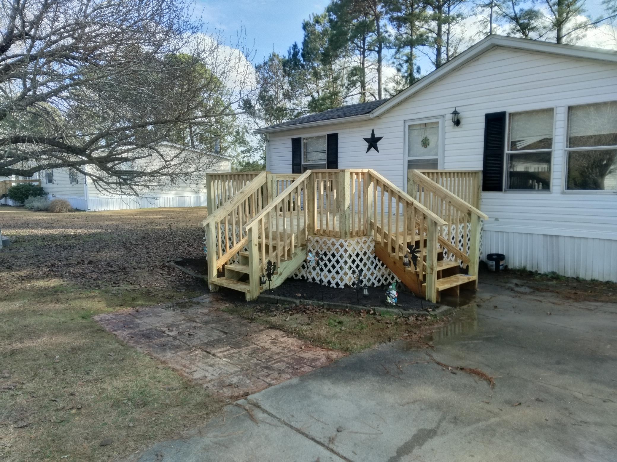 After: new PT wood deck dual staircases lattice skirting — Conway SC