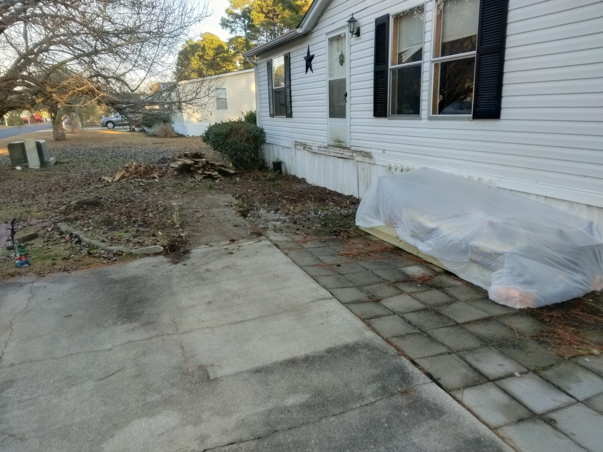 Before: deteriorated deck removed lumber staged — Conway SC
