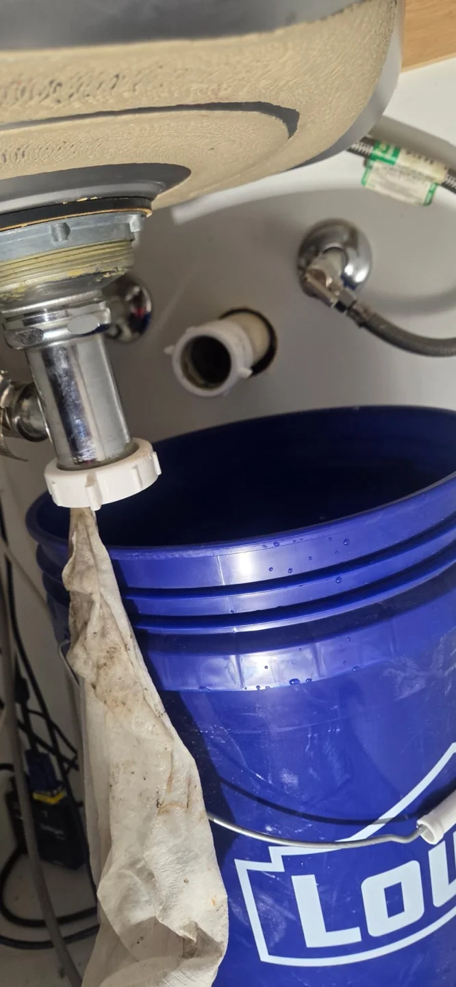 Sink drain components during access in Conway