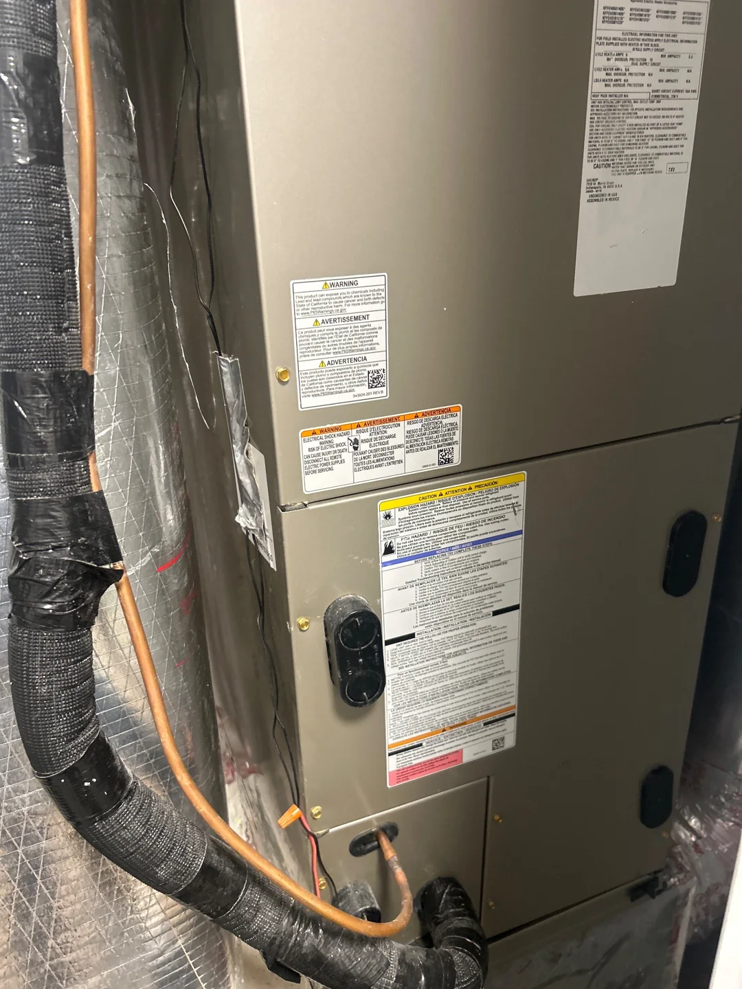 Air-handler cabinet and piping in Myrtle Beach · Coventry Apartments