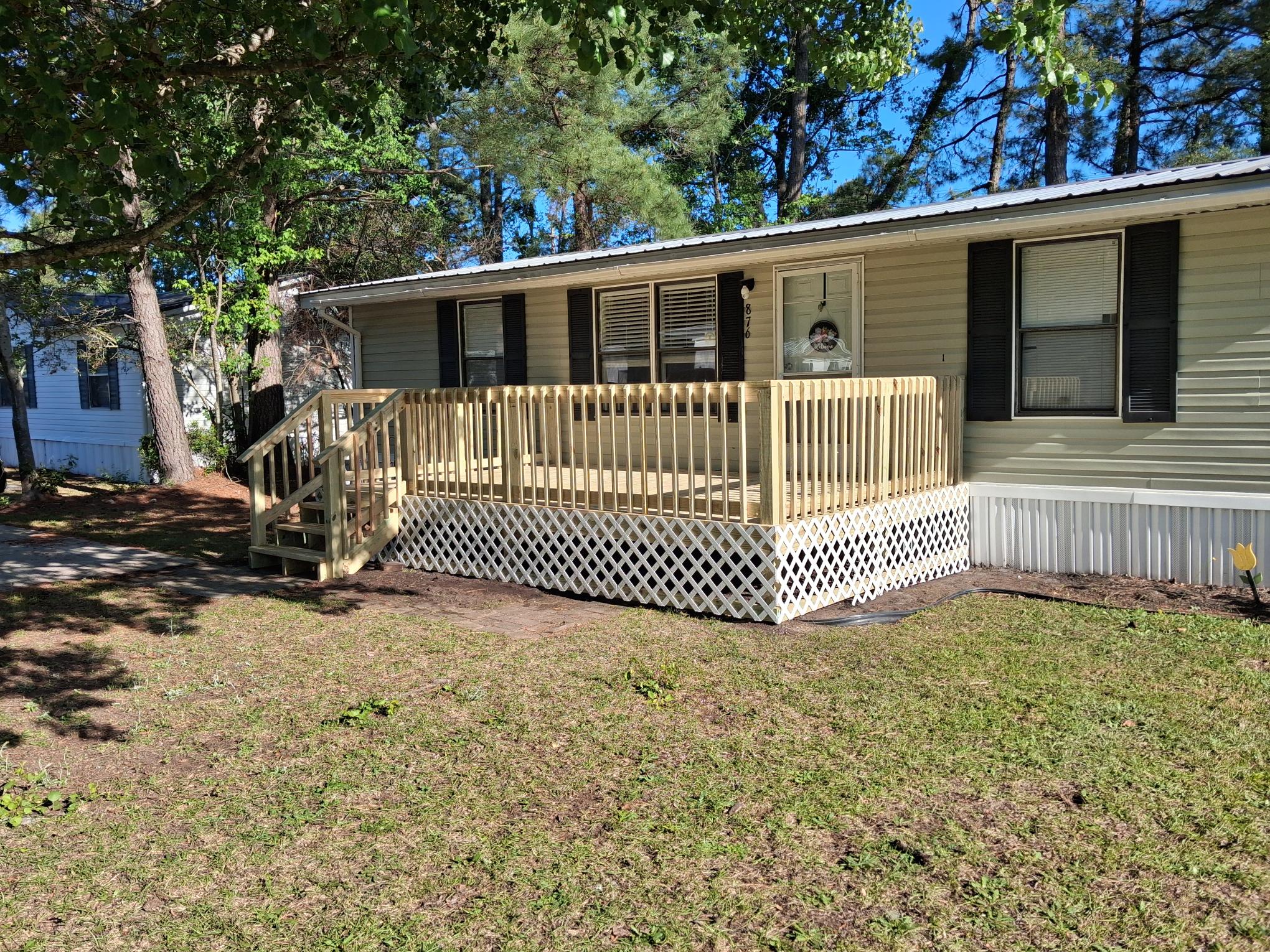 After: full-width PT wood front deck lattice skirting — Murrells Inlet SC